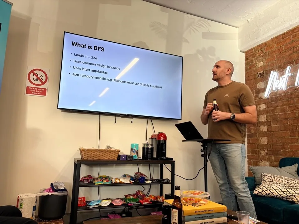 Sammy explaining Built for Shopify, beer in hand